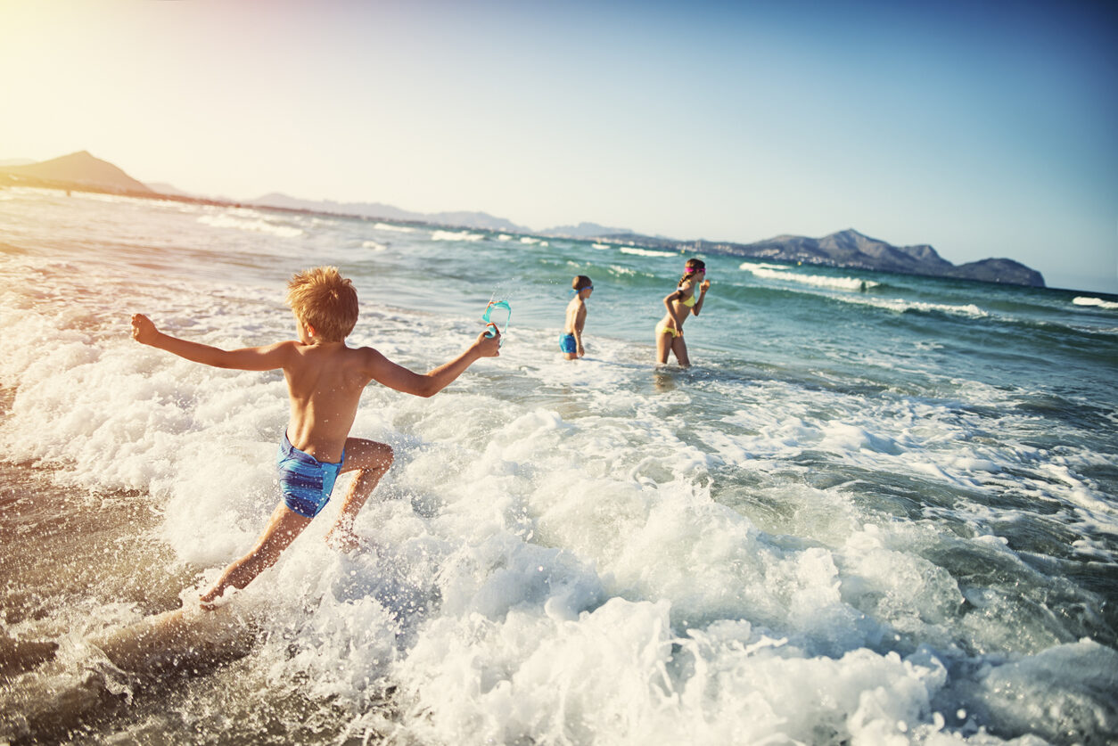 Summer vacations - kids playing at sea